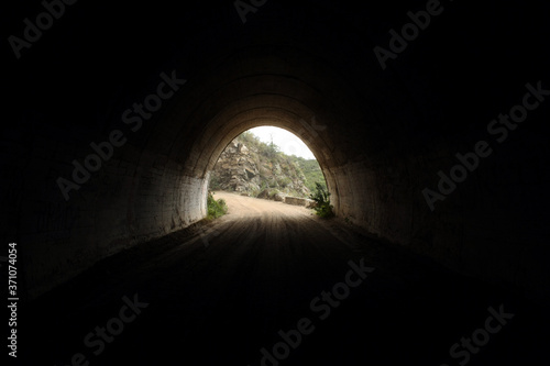 Transport and architecture. View of the dirt road from inside the Taninga tunnels in Cordoba, very high in the mountain. photo