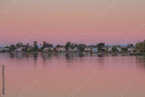 Reflection of Suburb from Lake in the Morning