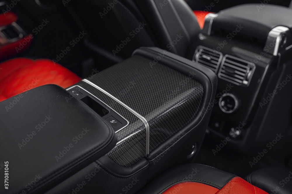 Luxury car rear seat row with carbon armrest