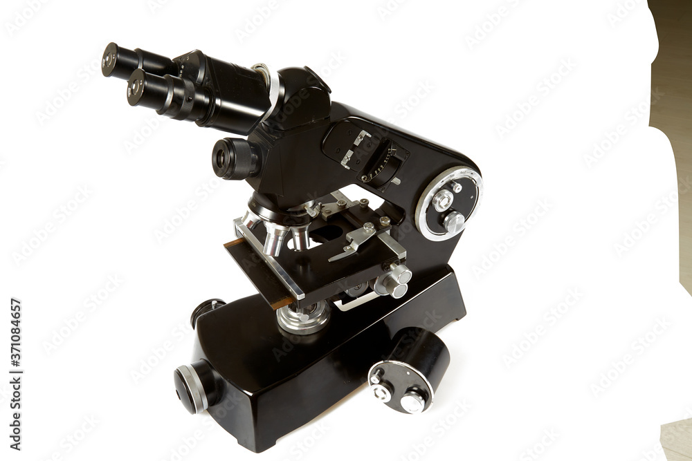 Fototapeta premium black vintage microscope isolated on white background