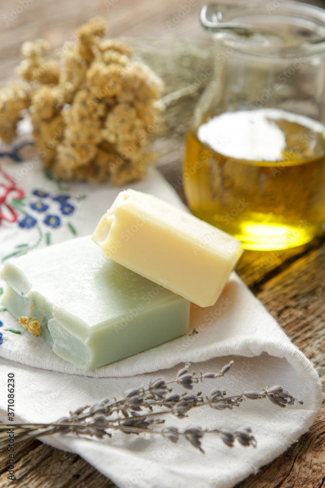 Handmade soap with herbal ingredients around. Homemade toxic-free natural organic cosmetic.