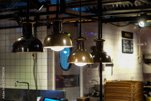 Vintage lamps on the background of cafe kitchen