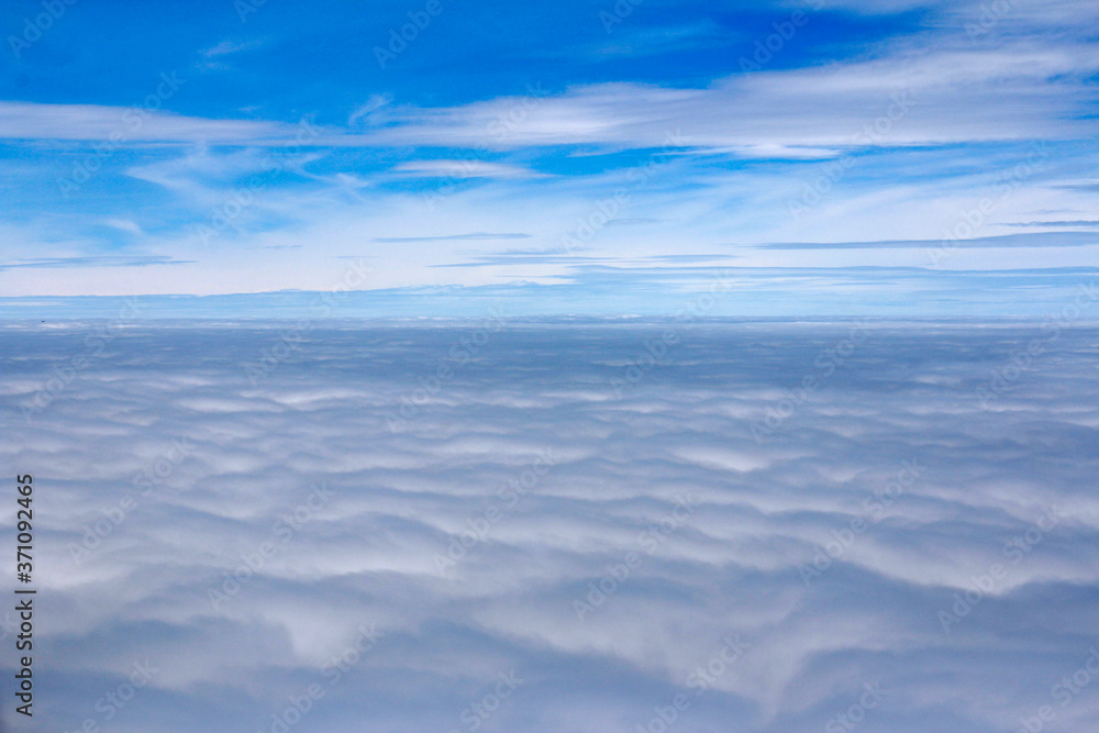 Dramatic cloudscape from the airplane's window Dramatic cloudscape from the airplane's window