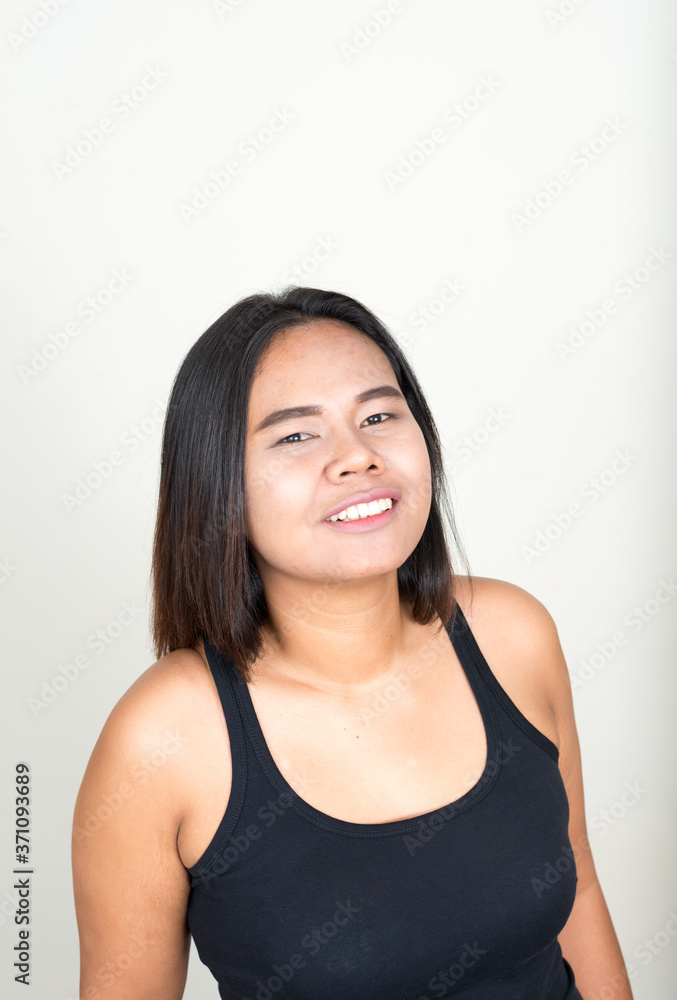 Portrait of happy young overweight Asian woman Portrait of happy young overweight Asian woman