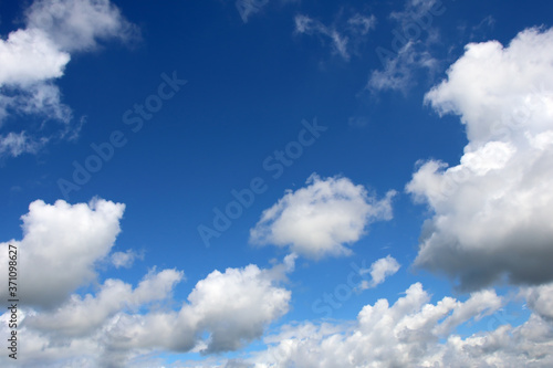 White fluffy clouds on a gentle blue sky
