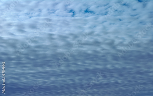 Blue sky texture with braid shaped clouds