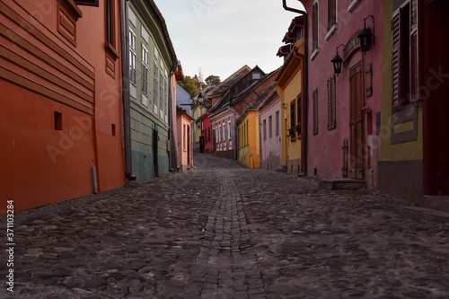 dusk in historic colorful streets of Sighisoara with stone floor
