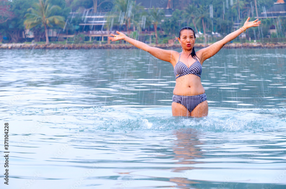 Fototapeta premium Woman in bikini exercise in morning at beach