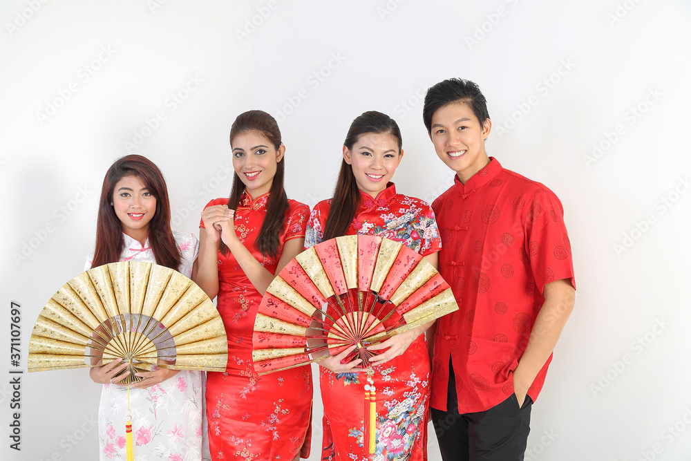 South East Asian young Malay Chinese Indian man woman wearing traditional chinse cheongsam dress on white background shop exchange gift orange greetings share racial unity harmony hand fan South East Asian young Malay Chinese Indian man woman wearing traditional chinse cheongsam dress on white background shop exchange gift orange greetings share racial unity harmony hand fan