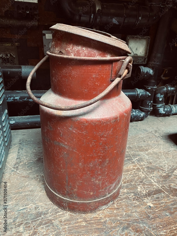 The old metal container with liquid The old metal container with liquid