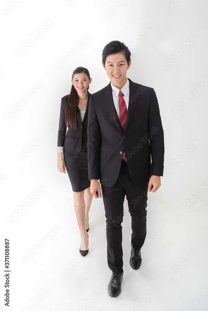 Asian young Chinese man woman wearing formal business office ware on white background walk forward confident following Asian young Chinese man woman wearing formal business office ware on white background walk forward confident following