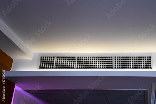 built in ceiling unit of FCU and return air grill, VRV VRF multi-split type air conditioner system in hotel room, Concept image for HVAC system or temperature .