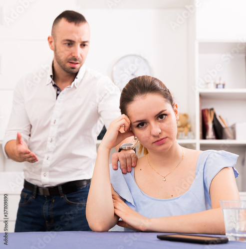 Woman is upset because she quarrel with her husband at home.