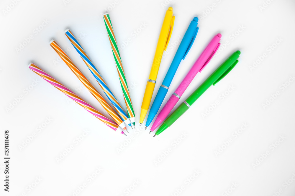 A fan of multicolored handles on a white background. Simple background for business and school