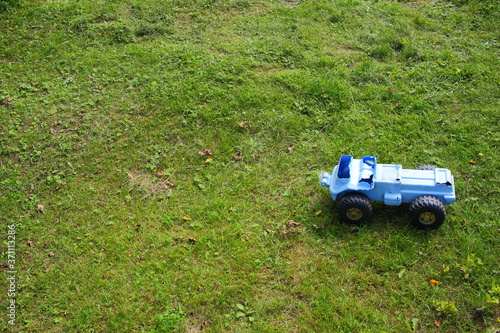 Old broken baby toy on the grass