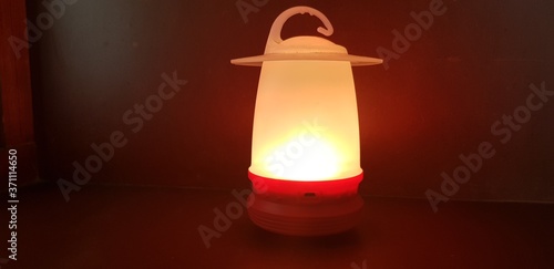 red candle on a dark background