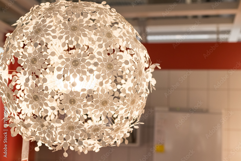 White lamps - chandeliers in the shape of a ball of daisies on the blurred  background.white lightning ball. modern art luxury chandelier.ighting ball  hanging from the ceiling.Spherical lamp Stock Photo | Adobe