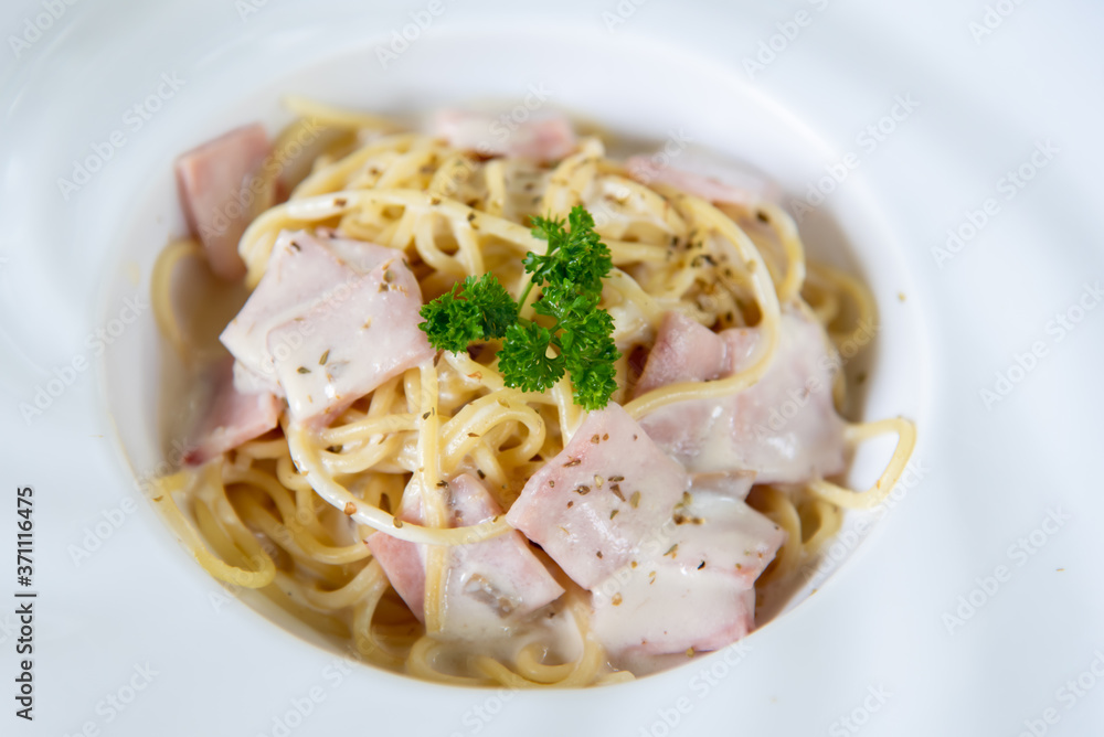 Closeup spaghetti carbonara in white plate Closeup spaghetti carbonara in white plate