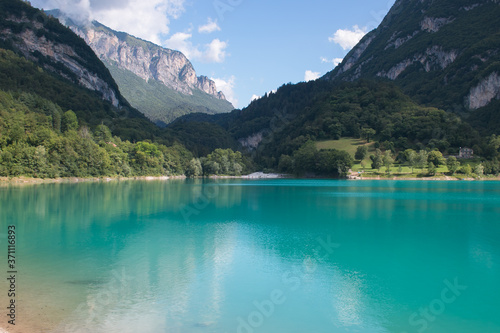 Fototapeta Naklejka Na Ścianę i Meble -  Panoramic view of Tenno lake in Trentino Alto-Adige during summer day, Italy