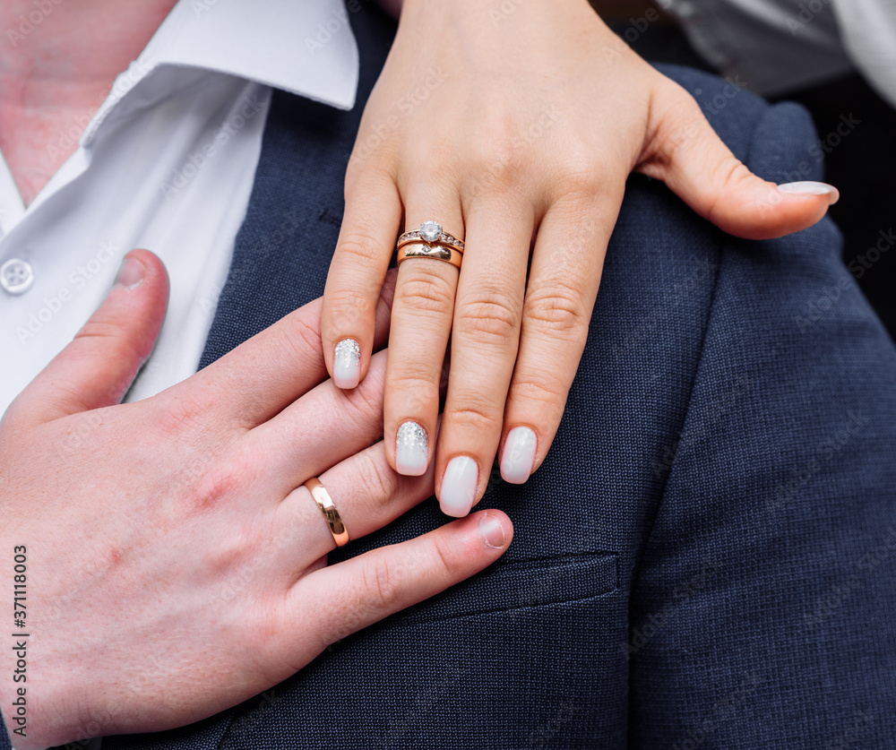 young people with twisted hands on which wedding engagement rings in white gold with diamonds. wedding ceremony marriage young people with twisted hands on which wedding engagement rings in white gold with diamonds. wedding ceremony marriage