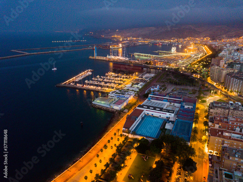 Aerial view of old town Almeria port and buildings at evening, Spain
