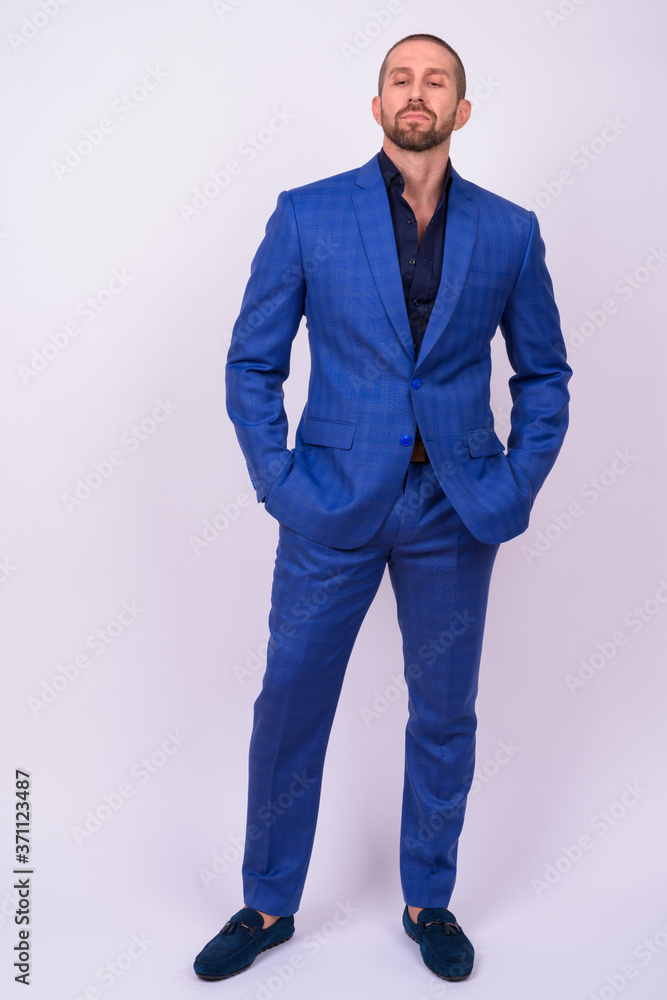 Portrait of handsome bald bearded businessman in suit Portrait of handsome bald bearded businessman in suit