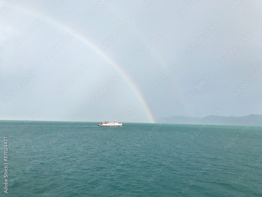 Koh Samui, Thailand – June 20,2020 : Rainbow in the sky over the sea after covid-19 lockdown.  