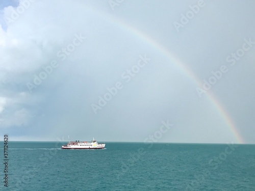 Koh Samui, Thailand – June 20,2020 : Rainbow in the sky over the sea after covid-19 lockdown.  