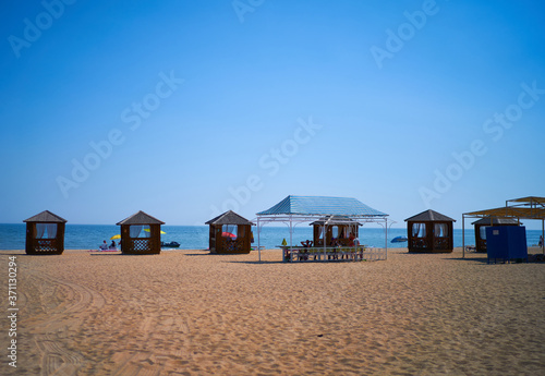 beach houses stand by the sea © Igor