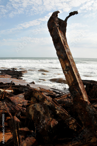 A red rusted skeleton of the Piratiny being eroded since 1943 on the West Coast of South Africa © Gerrit Rautenbach