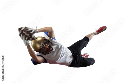 In jump, flight. American football player isolated on white studio background with copyspace. Professional sportsman during game playing in action and motion. Concept of sport, movement, achievements.