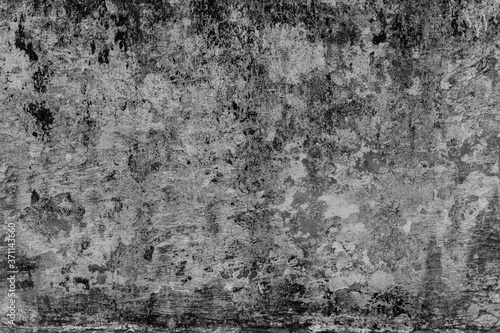 Grunge cracked black concrete wall, Old black cement wall with peeling plaster.