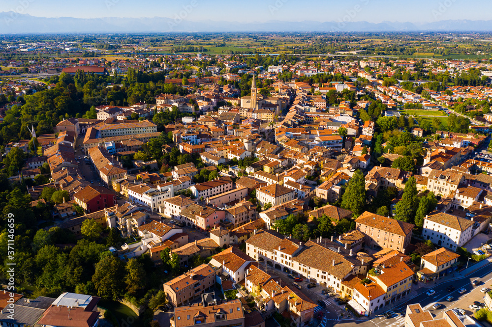 Scenic cityscape from drone of Italian town of Portogruaro in sunny day, Veneto, Italy