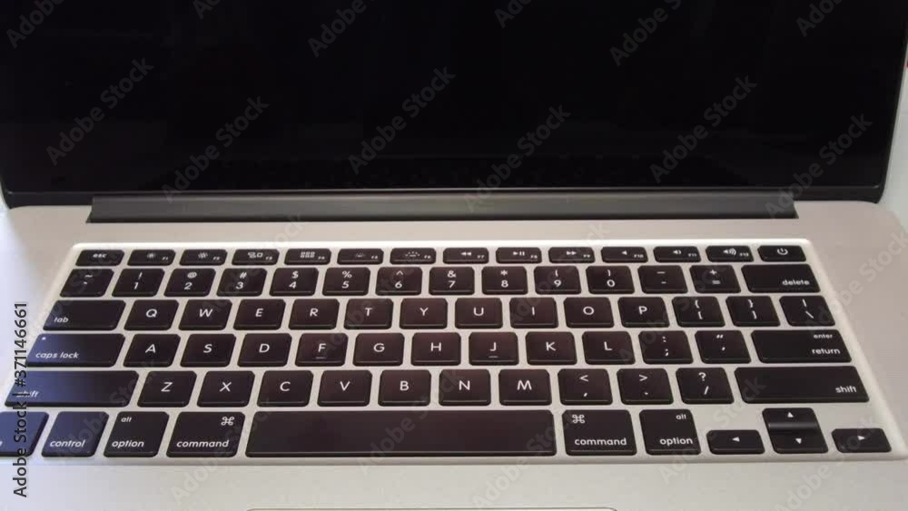 4340 - Man Typing the Letter R Key on Laptop Computer