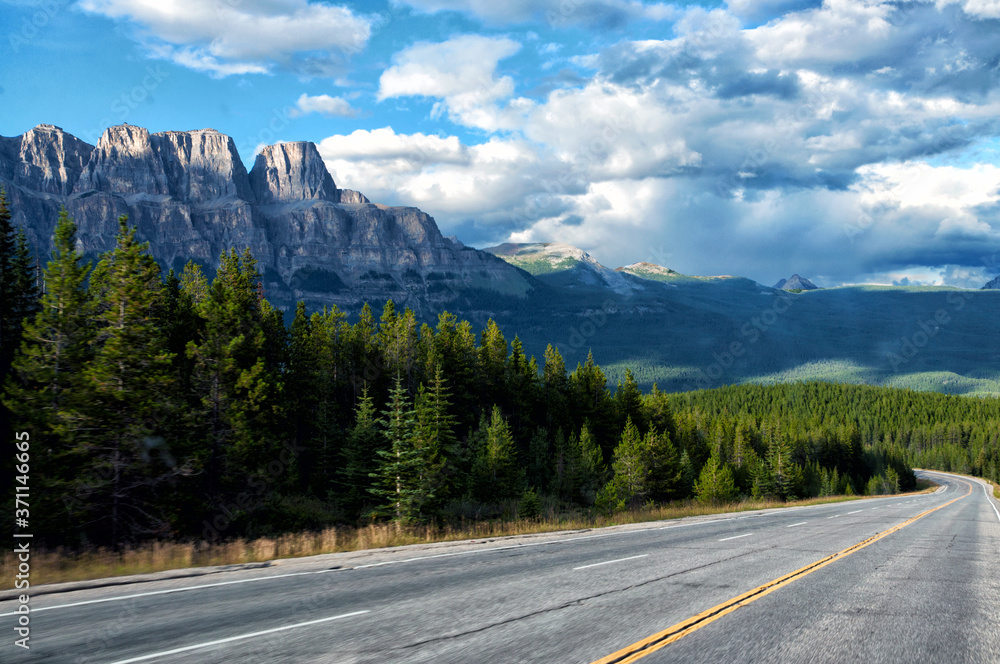 Highway passing below the Canadian Rockies, Banff National Park, Alberta Highway passing below the Canadian Rockies, Banff National Park, Alberta