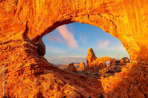 Turret arch through the North Window in Arches National Park in Utah photo