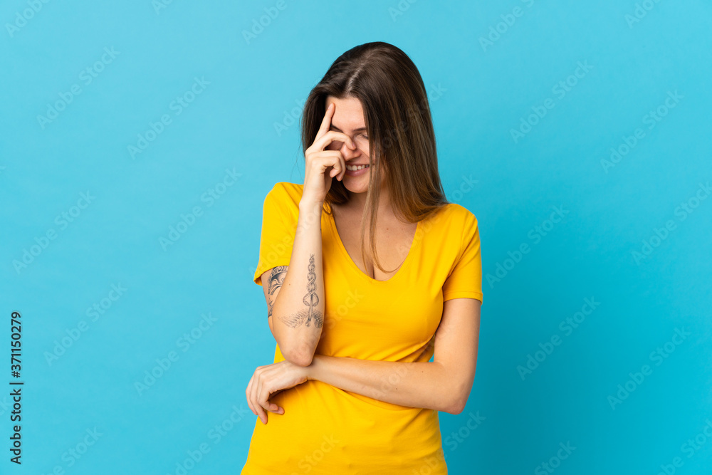 Young slovak woman isolated on blue background laughing Young slovak woman isolated on blue background laughing