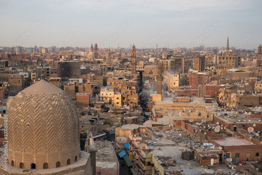 Elevated image from Bab Zuwayla of downtown Cairo with old ocher buildings