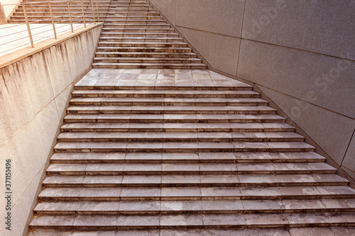 a wide concrete staircase leads up