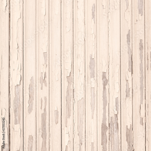 old beige grungy paint blisters on vertical wooden planks
