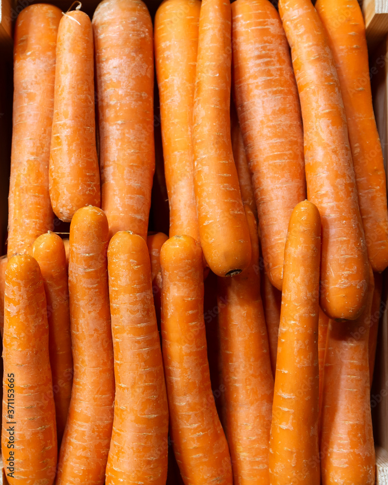 Fresh carrots on a food market. Close up. Fresh carrots on a food market. Close up.