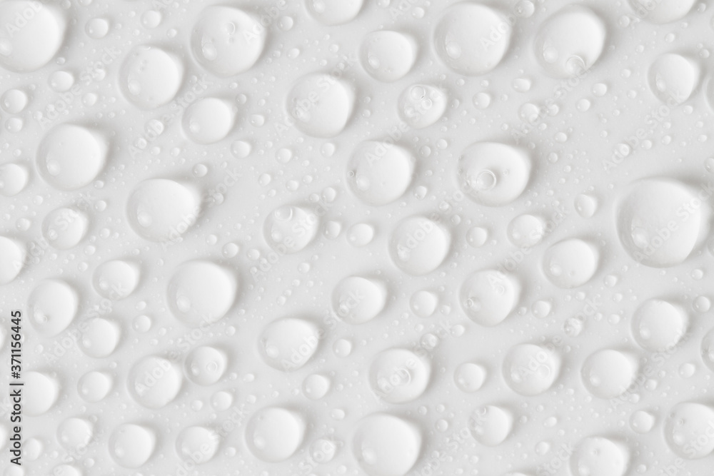 Water drops on gray background. Top view. Closeup. Water drops on gray background. Top view. Closeup.