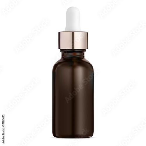 Cosmetic serum dropper bottle. Brown glass vial photo