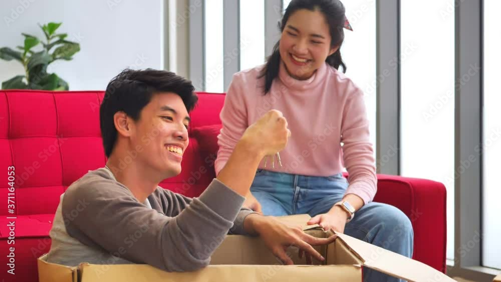 Happy young couple moving in to new home together. Happy young couple moving in to new home together.