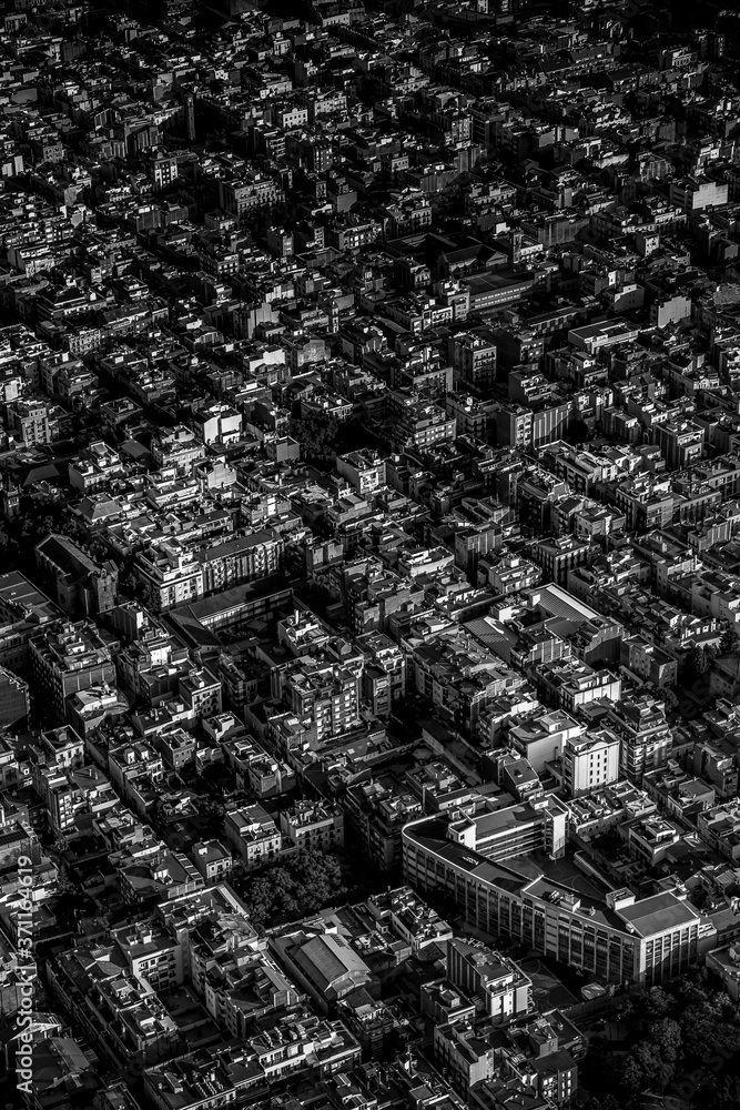 Aerial view of typical buildings of Barcelona cityscape from helicopter. in black and white. fine art