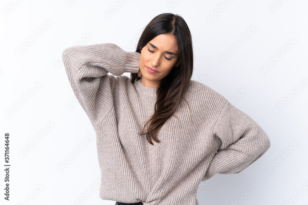 Young brunette woman over isolated white background with neckache Young brunette woman over isolated white background with neckache