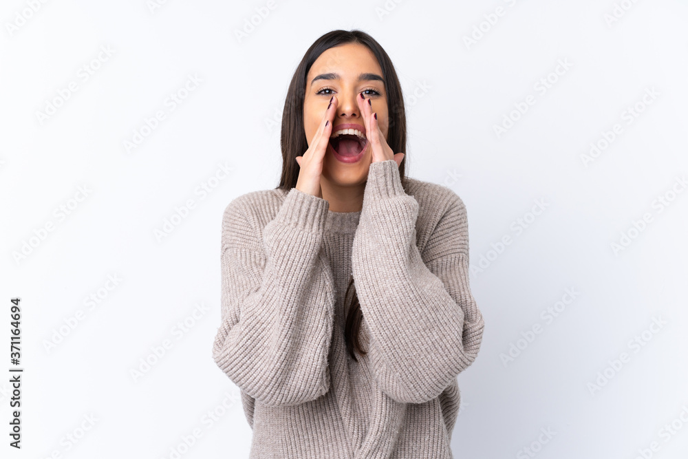 Young brunette woman over isolated white background shouting and announcing something Young brunette woman over isolated white background shouting and announcing something