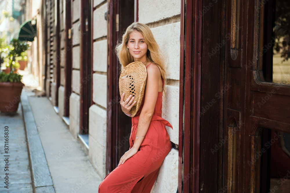 Young woman with hat on the street