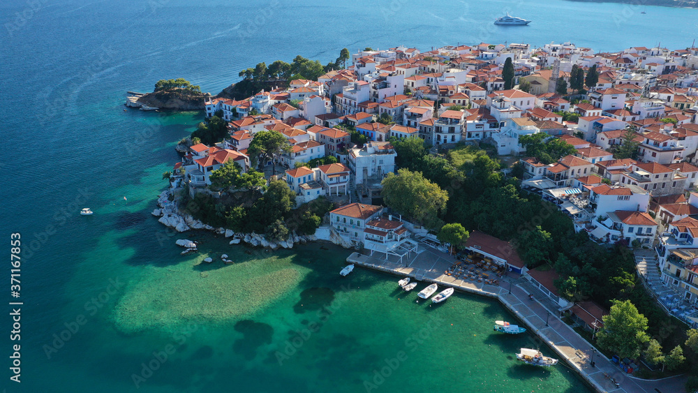 Aerial drone panoramic photo of picturesque main town of Skiathos island featuring small landmark peninsula of Bourtzi, Sporades, Greece