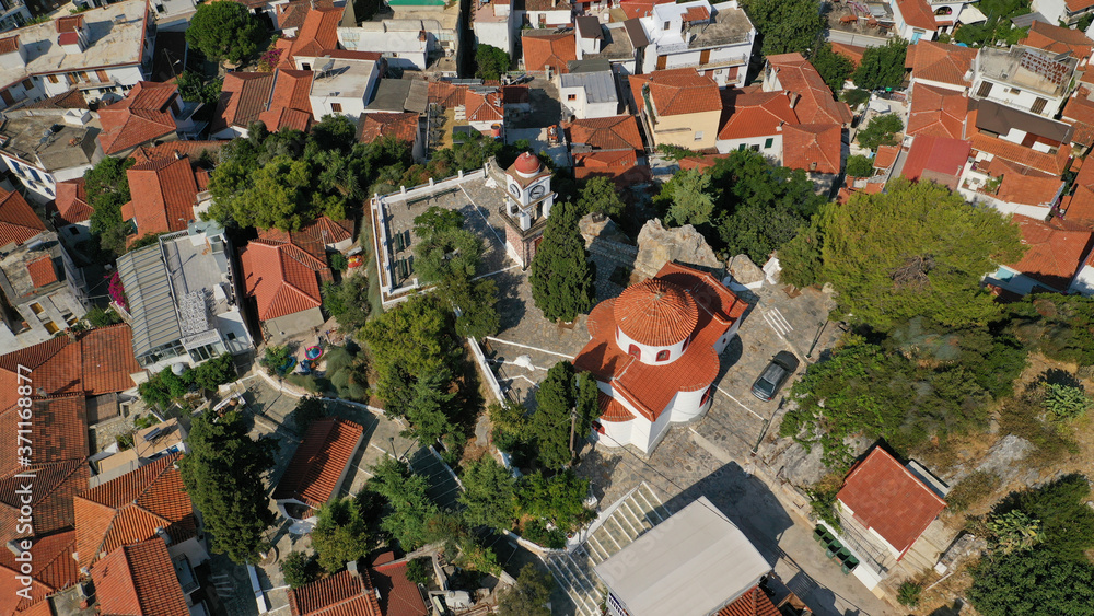 Naklejka premium Aerial drone panoramic photo of picturesque main town of Skiathos island featuring small landmark peninsula of Bourtzi, Sporades, Greece